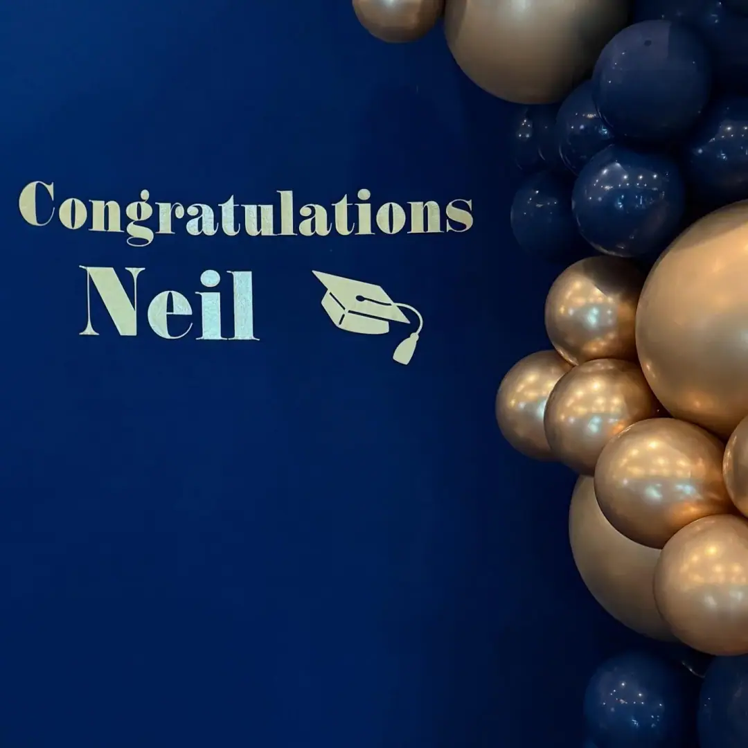 Congratulations, Neil! 🎓💙 This stunning navy and gold balloon arrangement sets the stage for a memorable graduation celebration.